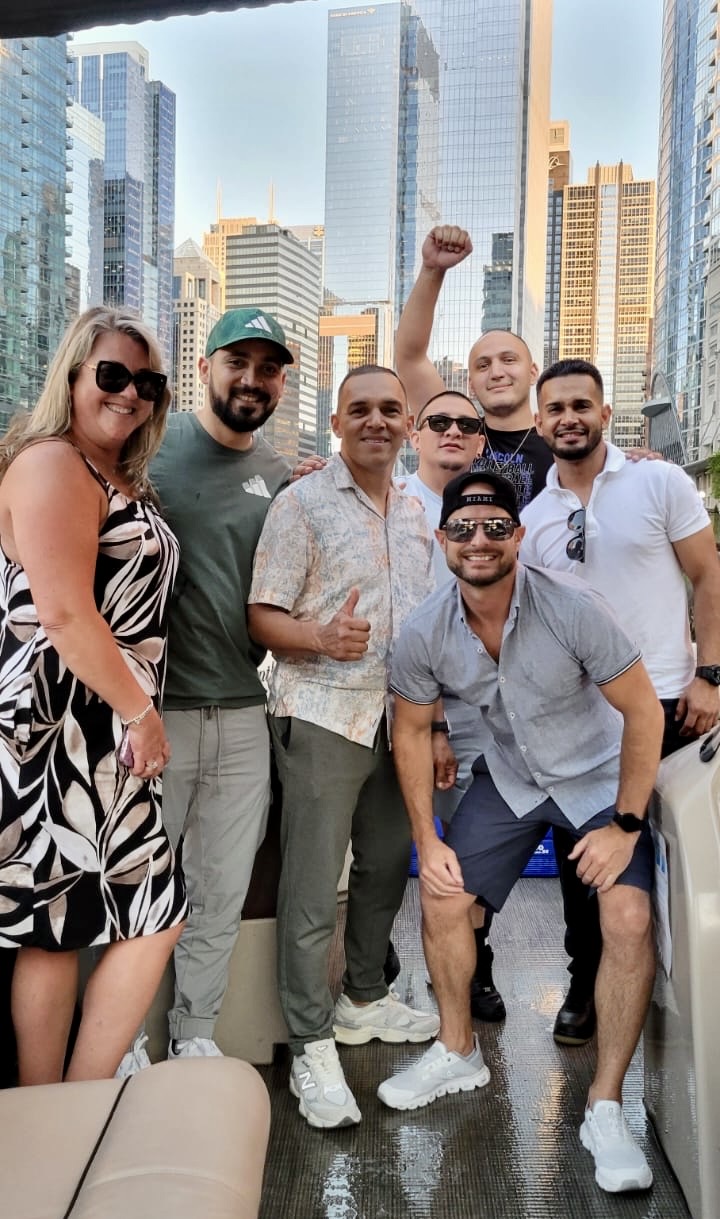 the grout medic of north chicago team on a boat in the river