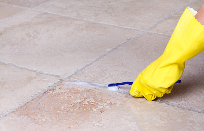 grout cleaning with bleach and scrub brush