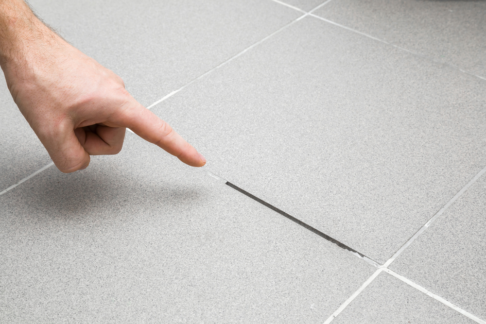 Missing grout leads to grout repair.