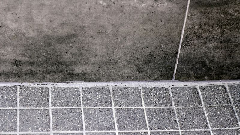 shower grout repair vs. shower regrouting